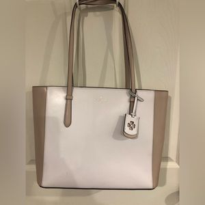 Kate spade tote. Used one summer.  2 small places as noted in pictures 14x11